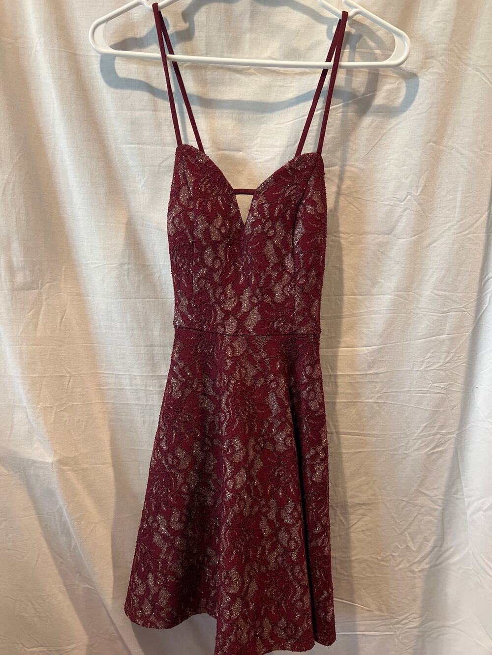 Size 5 wine colored spaghetti strap dress. Has some sparkle